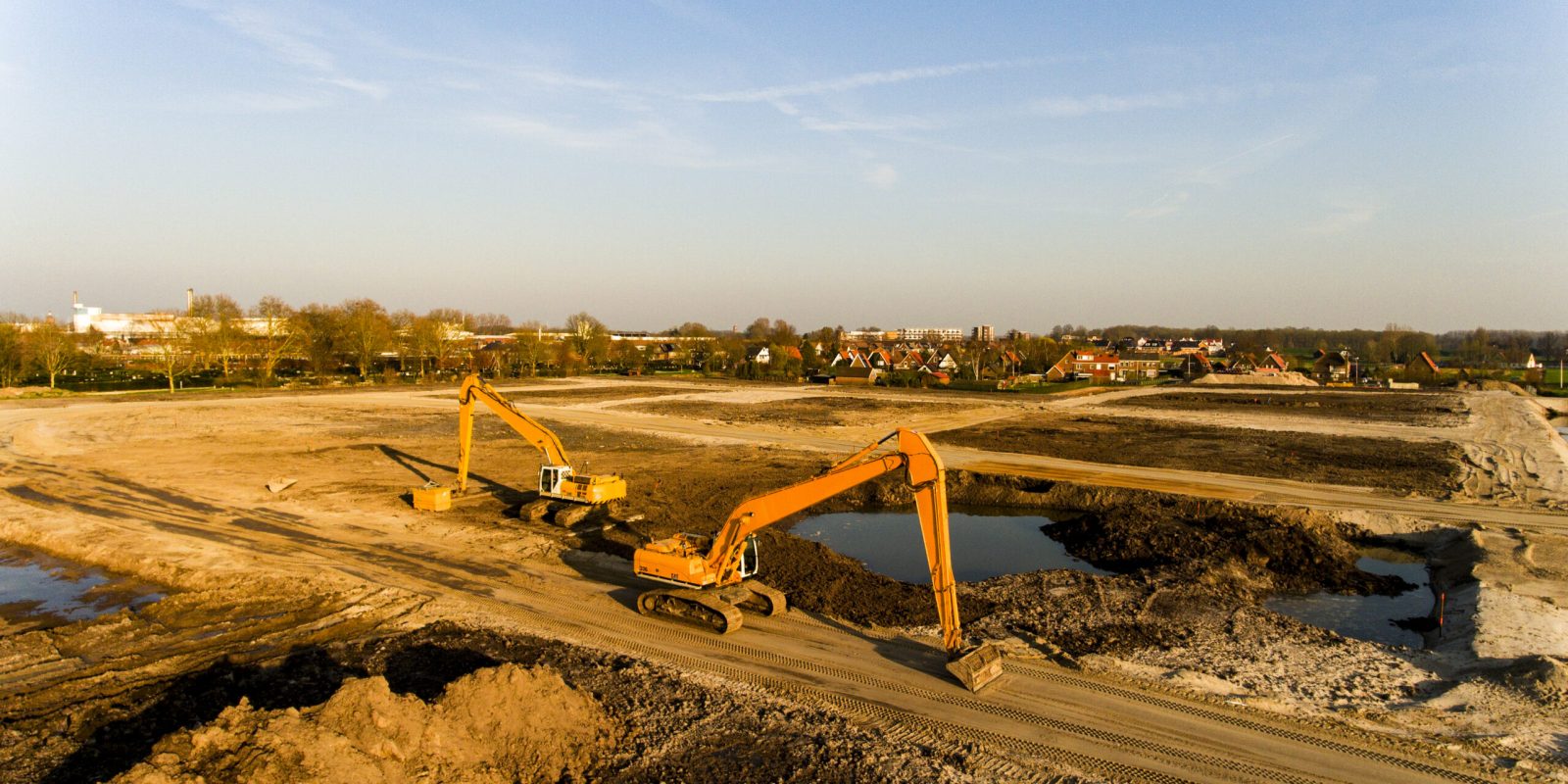 A high angle shot of two excavators on a building site